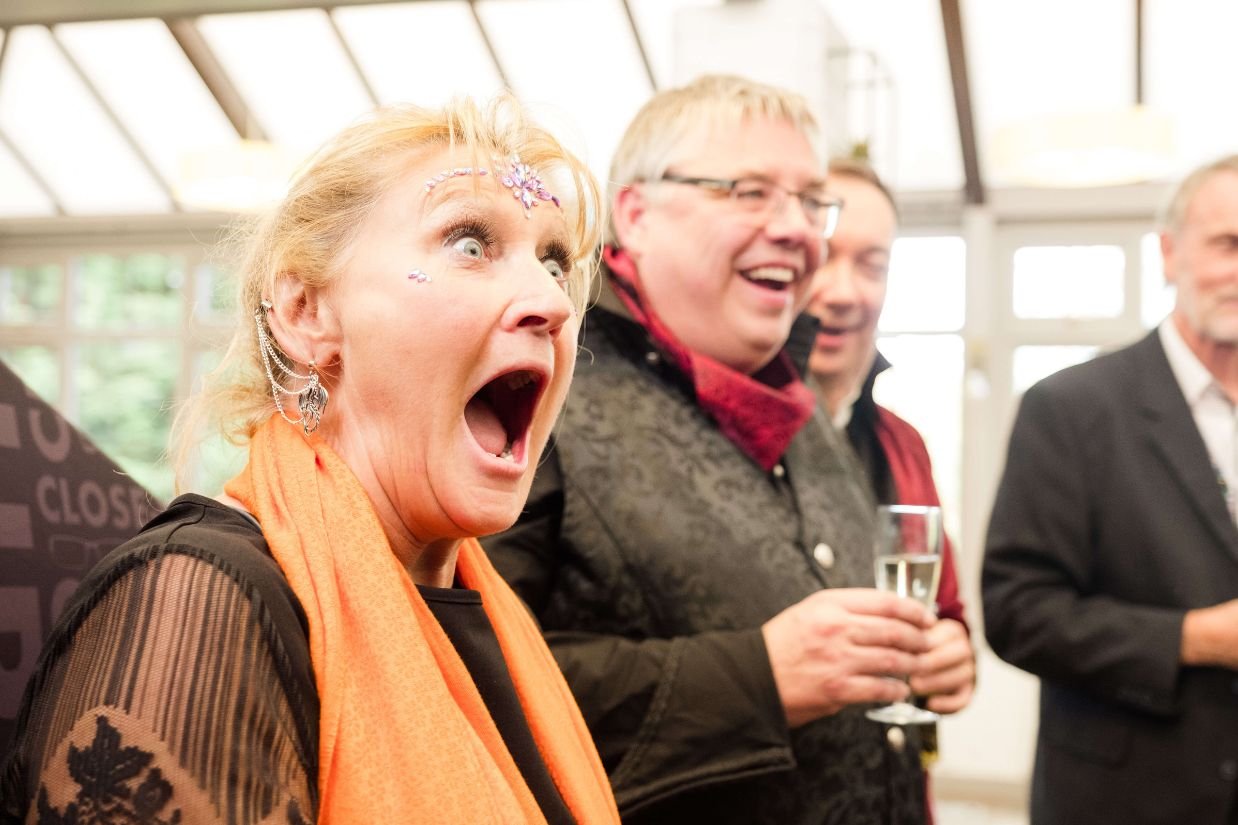 Guests reacting to Close-Up Chris at a private party in Birmingham